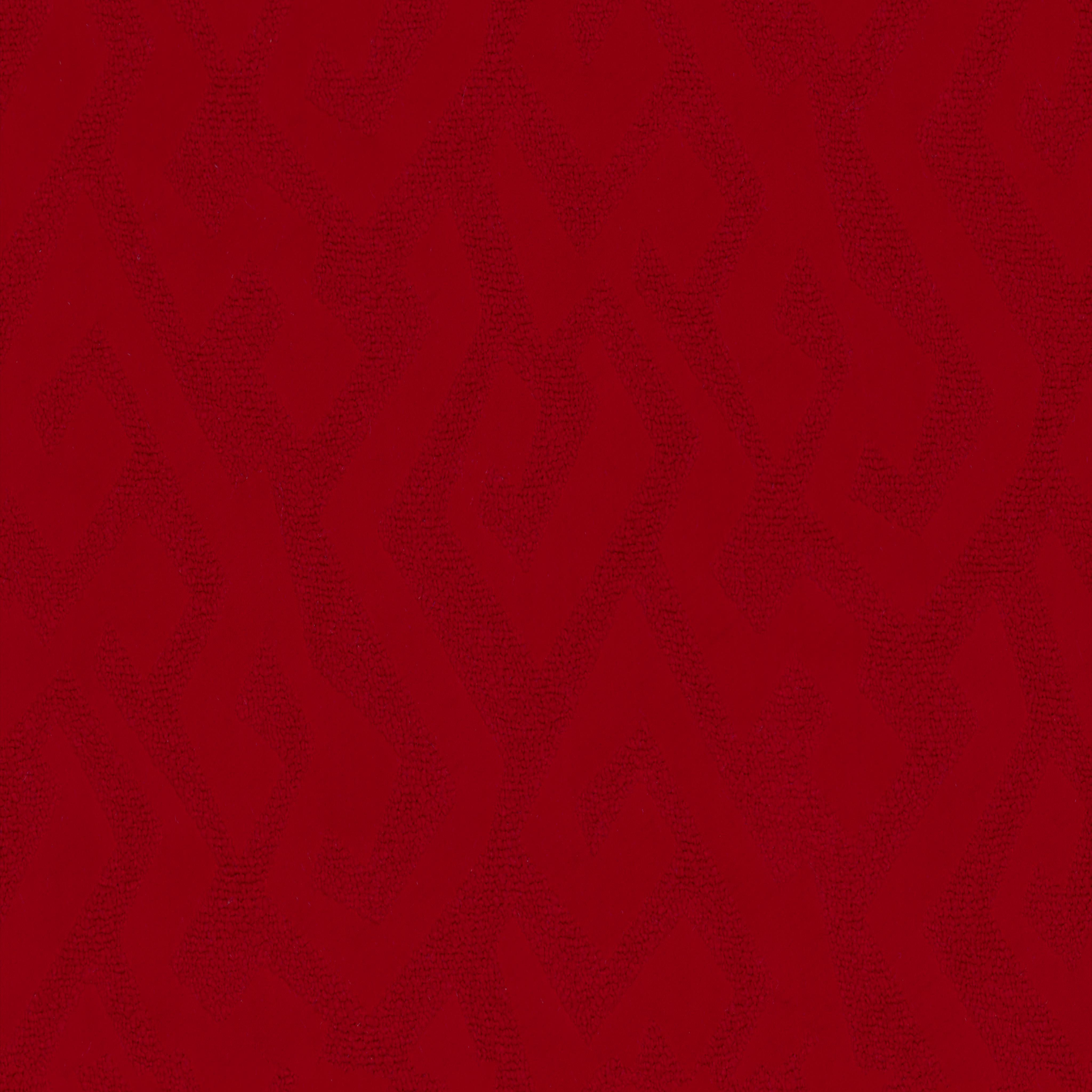 A seamless fabric texture with graphical red jacquard units arranged in a None pattern