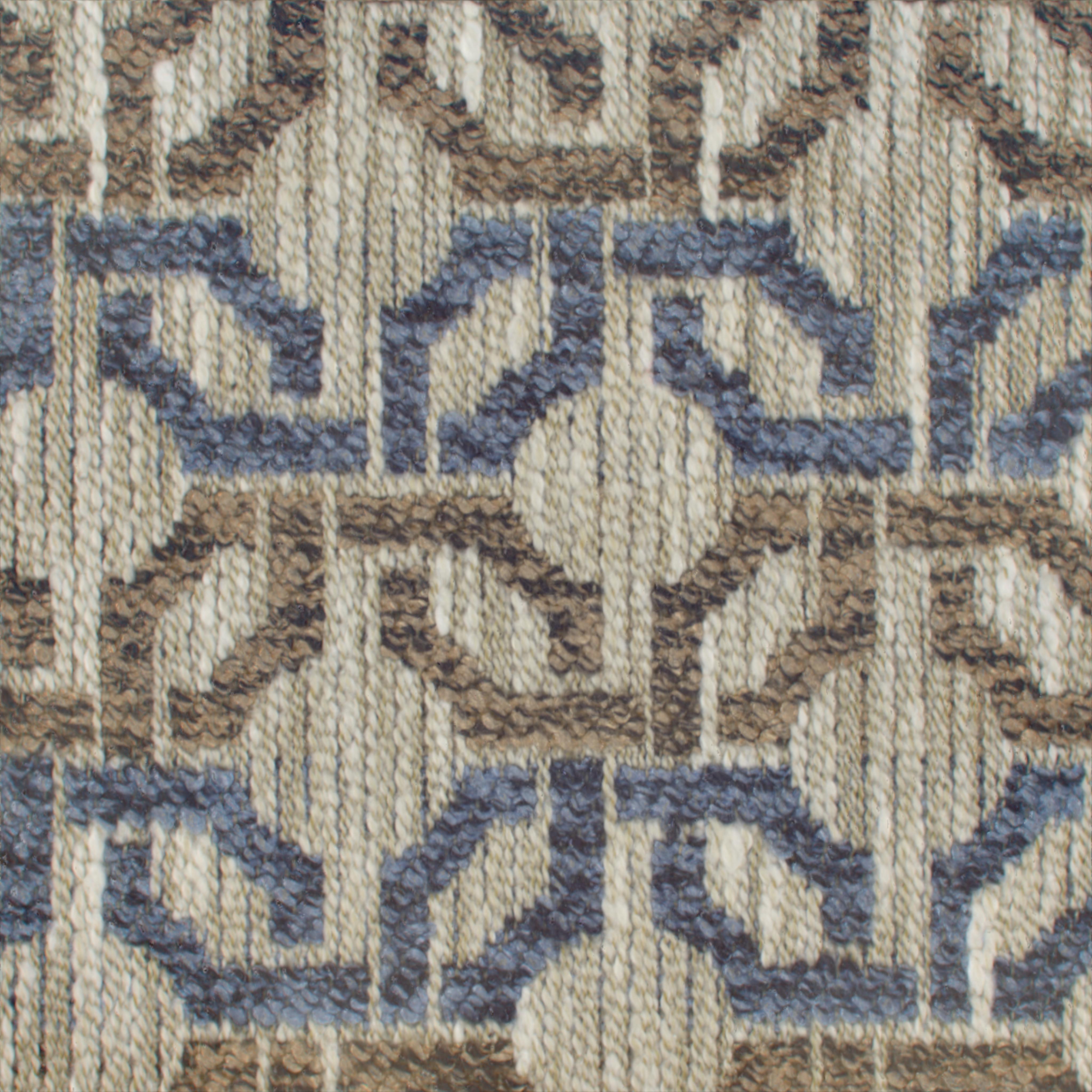 A seamless fabric texture with geometric blue jacquard units arranged in a None pattern
