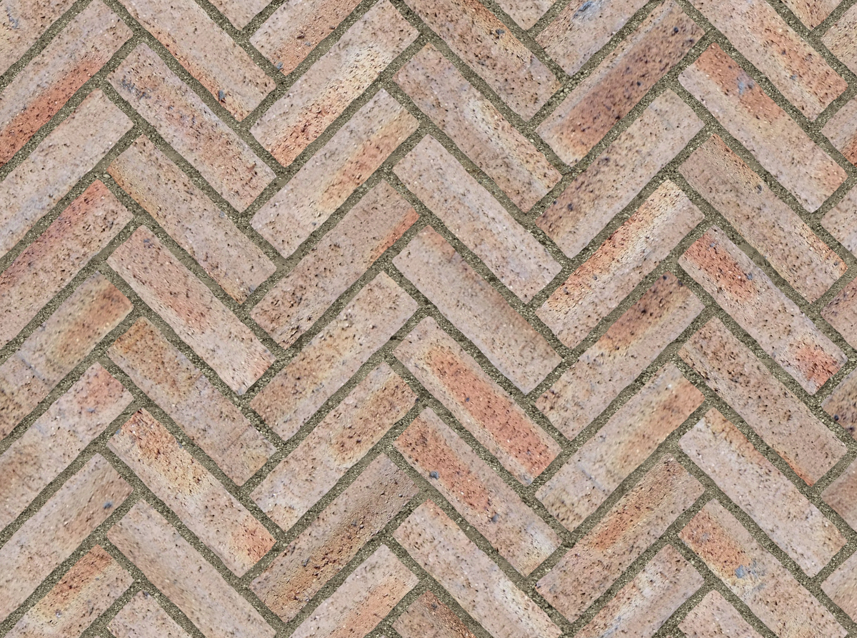 A seamless brick texture with dragfaced brick units arranged in a Herringbone pattern