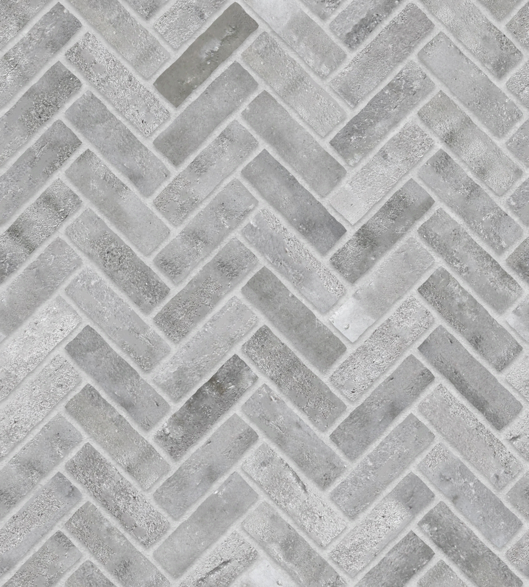 A seamless brick texture with finnish grey brick units arranged in a Herringbone pattern