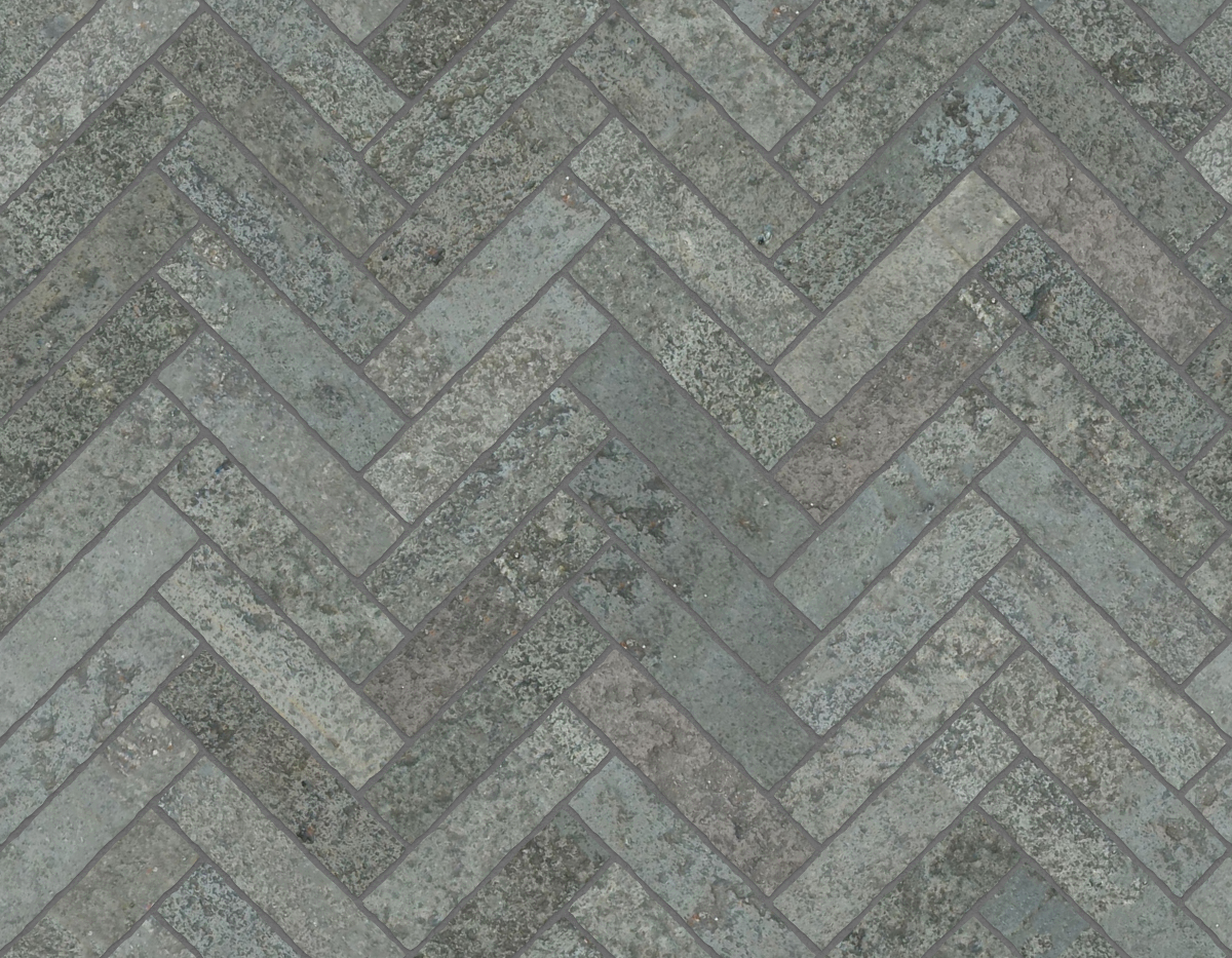A seamless stone texture with flagstone blocks arranged in a Herringbone pattern