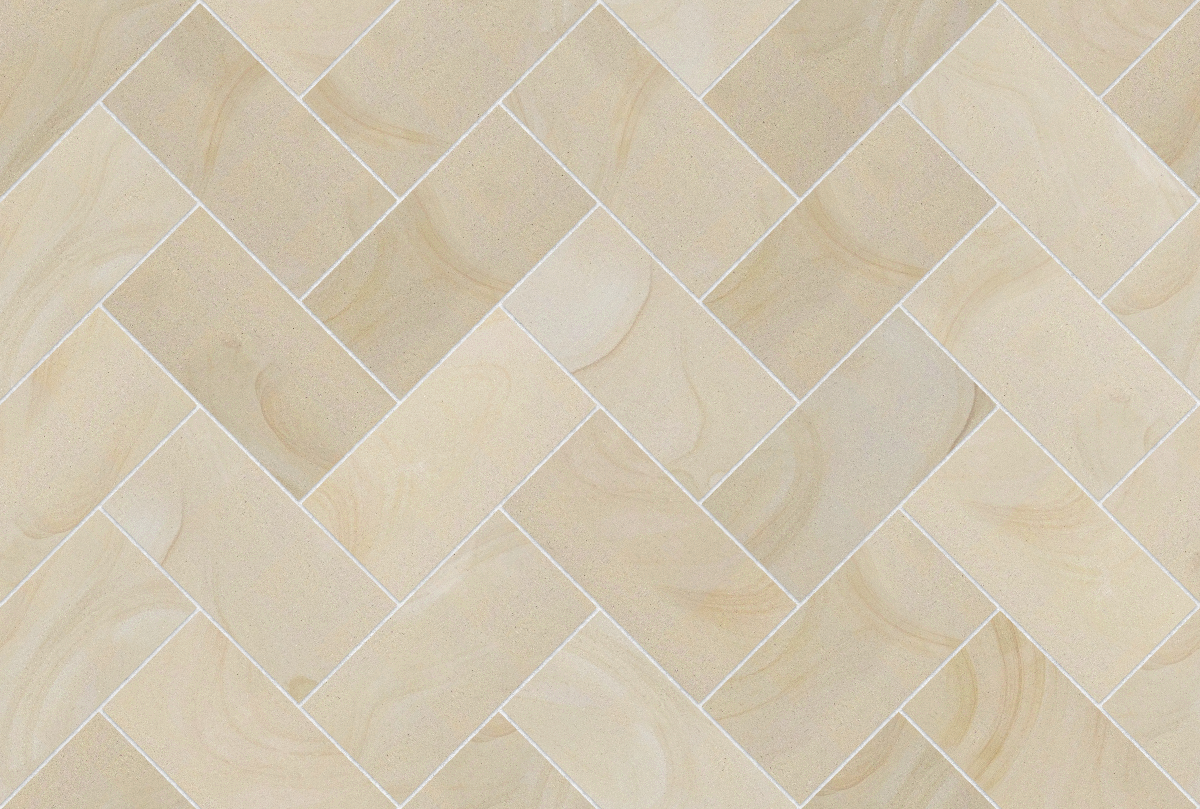 A seamless stone texture with blonde sandstone blocks arranged in a Herringbone pattern