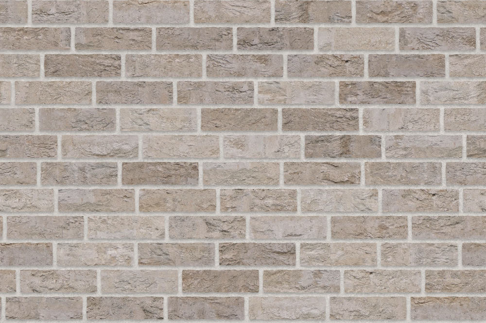 A seamless brick texture with buff units arranged in a Staggered pattern