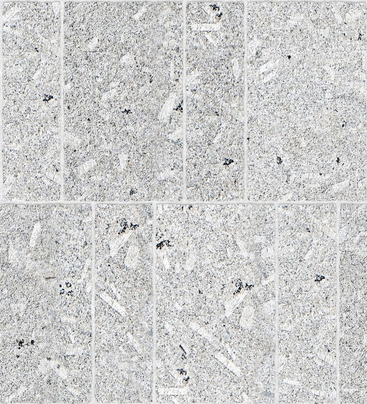A seamless stone texture with porphyritic granite blocks arranged in a Flemish pattern