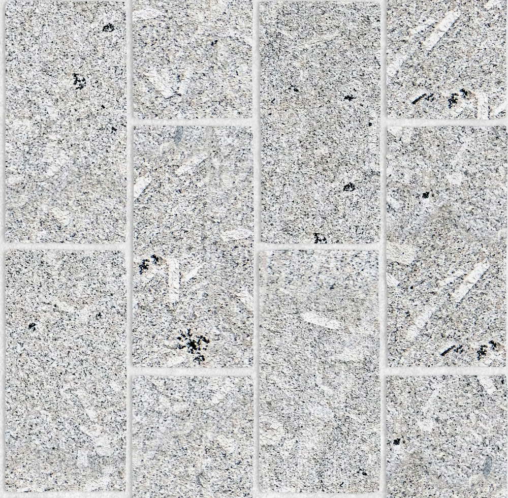 A seamless stone texture with porphyritic granite blocks arranged in a Stretcher pattern