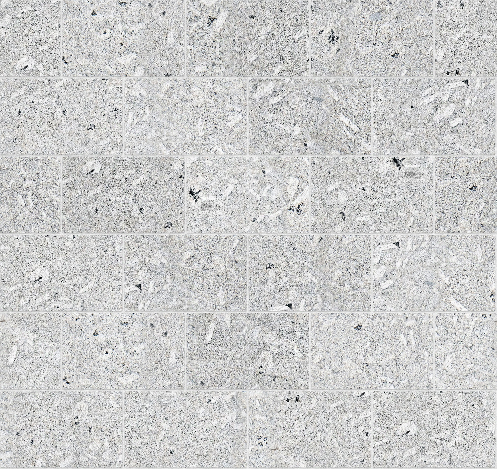 A seamless stone texture with porphyritic granite blocks arranged in a Stretcher pattern