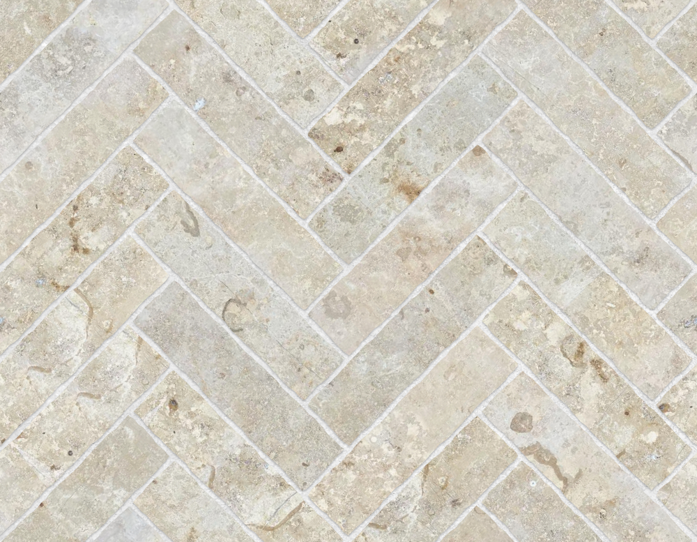 A seamless stone texture with limestone blocks arranged in a Herringbone pattern
