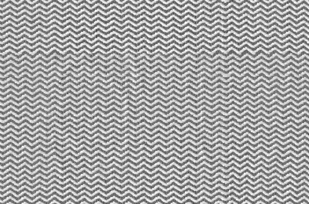 A seamless carpet texture with zigzag patterned textile units arranged in a None pattern