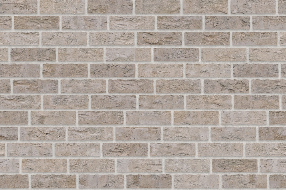 A seamless brick texture with buff units arranged in a Staggered pattern