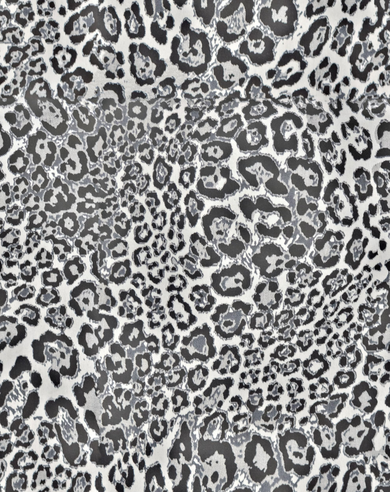 A seamless fabric texture with snow leopard print units arranged in a None pattern