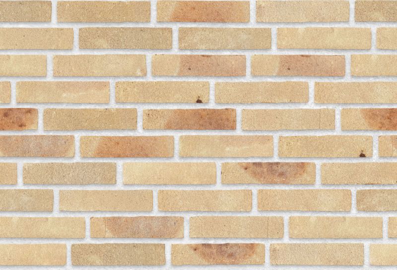 A seamless brick texture with nougat / raw units arranged in a  pattern