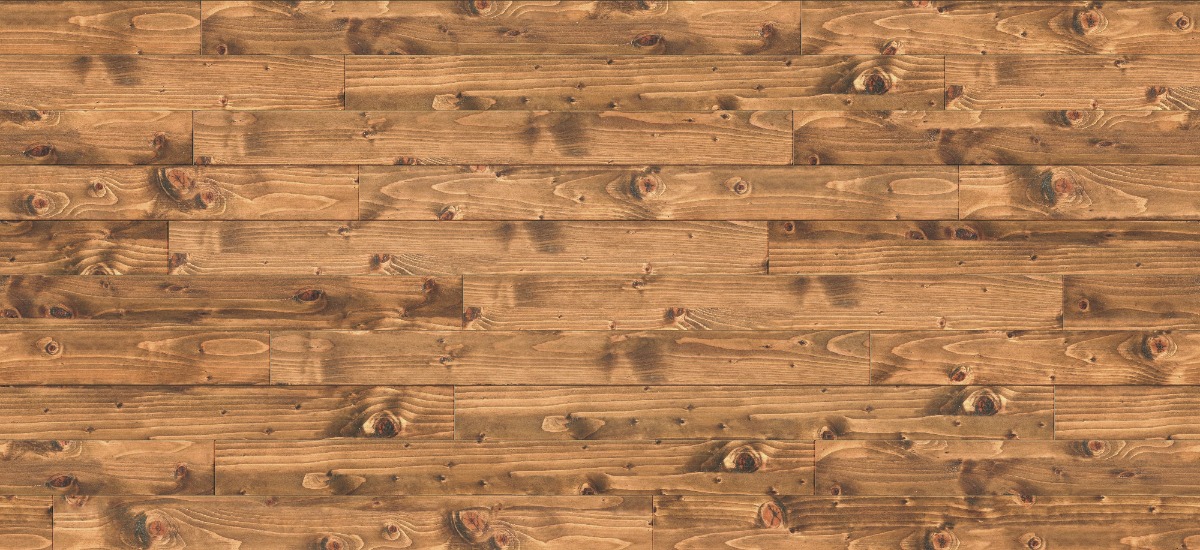 A seamless wood texture with stained spruce boards arranged in a Staggered pattern