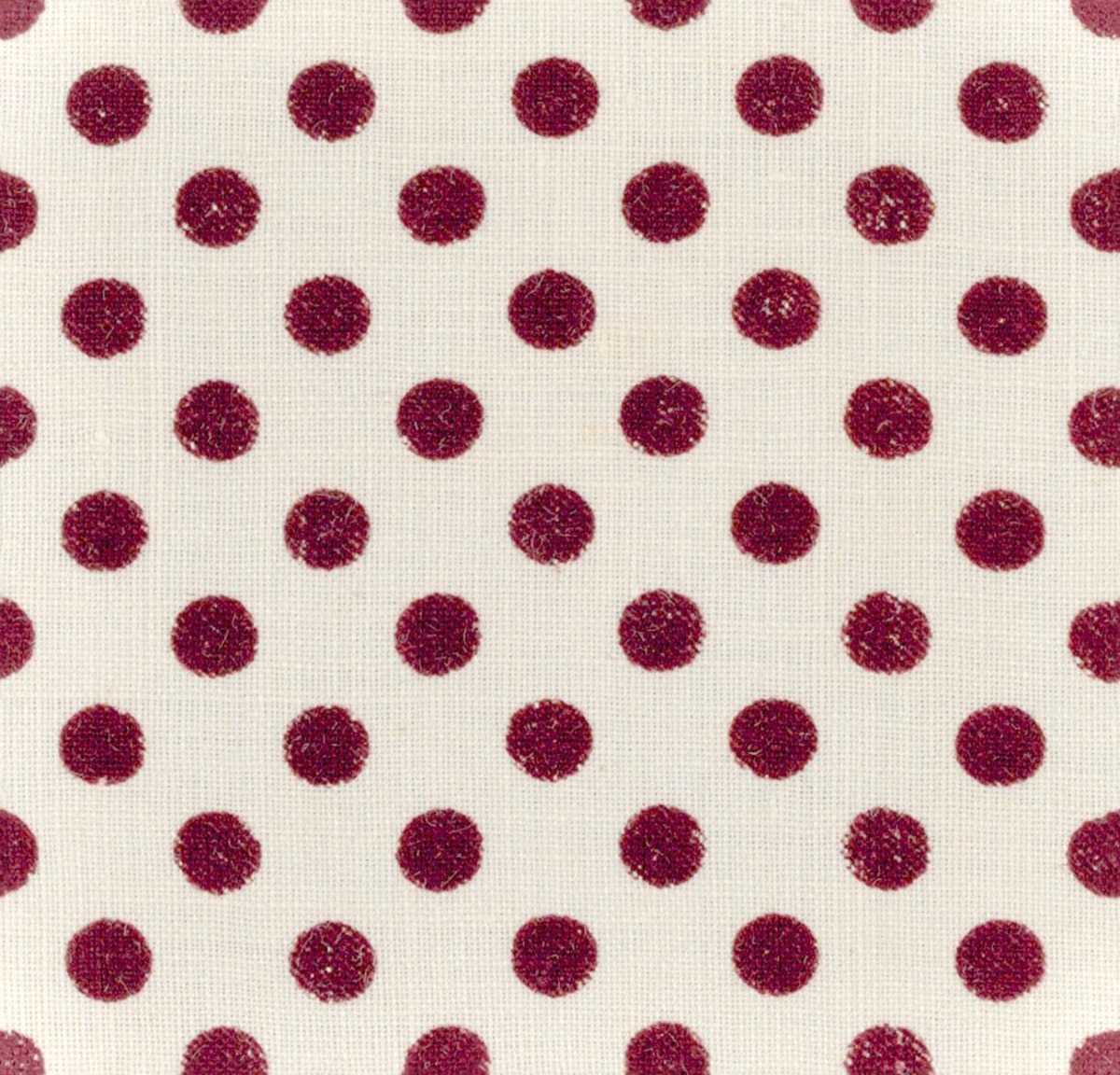 A seamless fabric texture with polka dot fabric units arranged in a None pattern