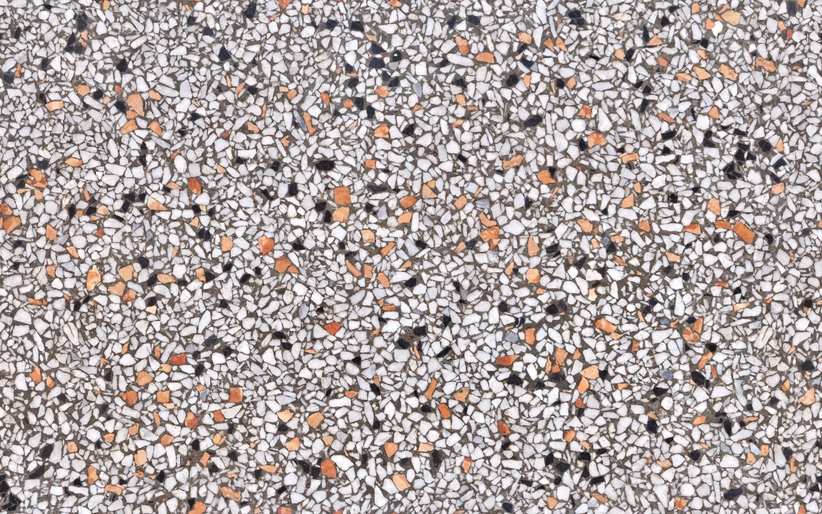 A seamless terrazzo texture with bianco arancia terrazzo units arranged in a None pattern