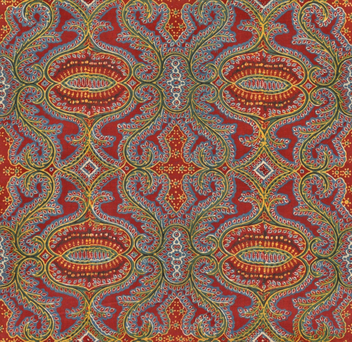 A seamless fabric texture with paisley print fabric units arranged in a None pattern