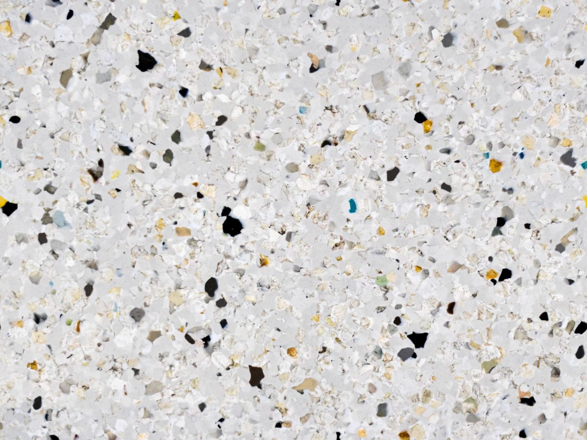 A seamless plastic texture with polygood terrazzo nuovo units arranged in a None pattern