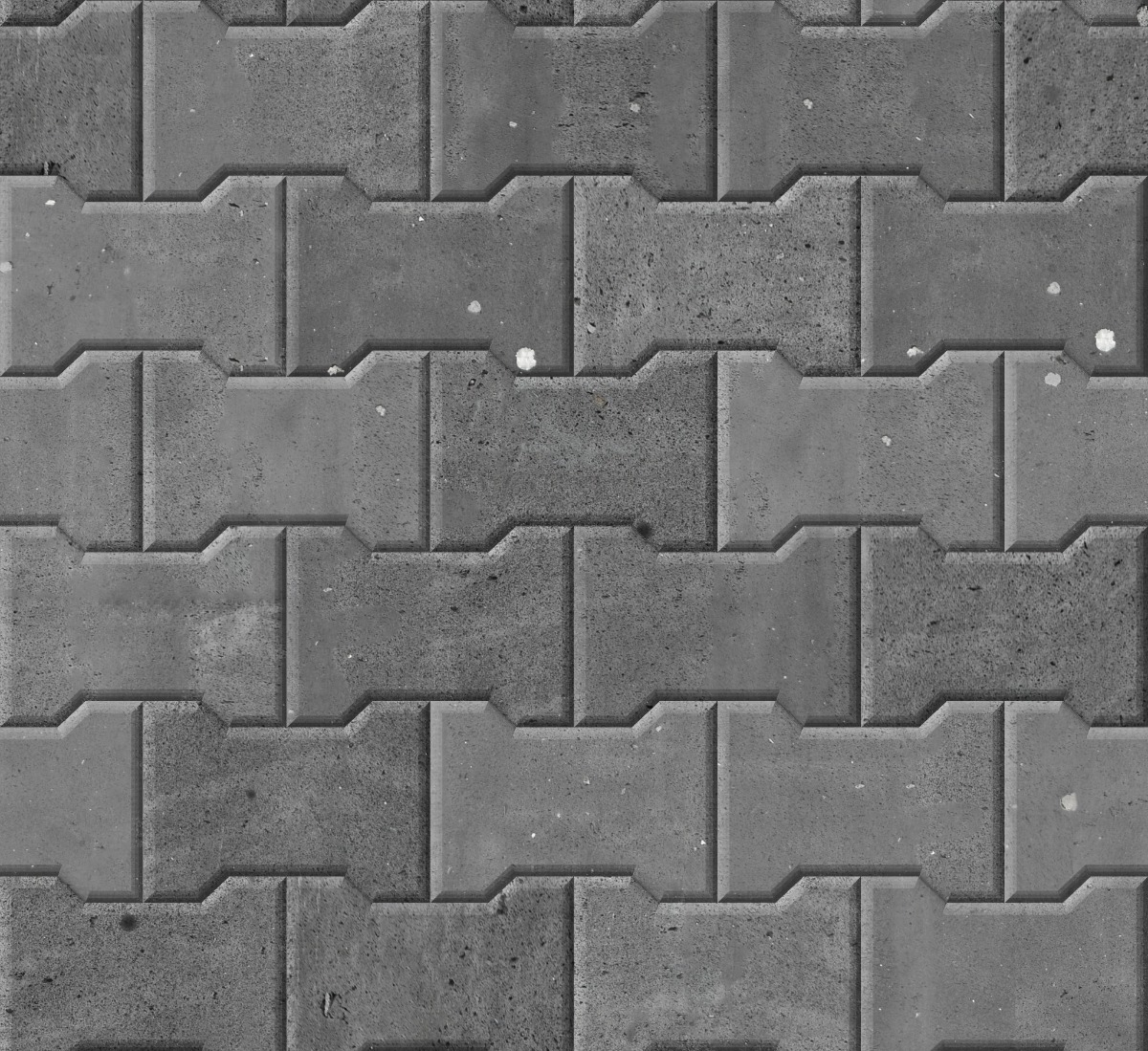 A seamless stone texture with basalt blocks arranged in a Bowtie Pavers pattern