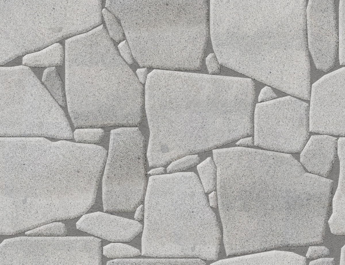 A seamless stone texture with granite blocks arranged in a Drystone pattern