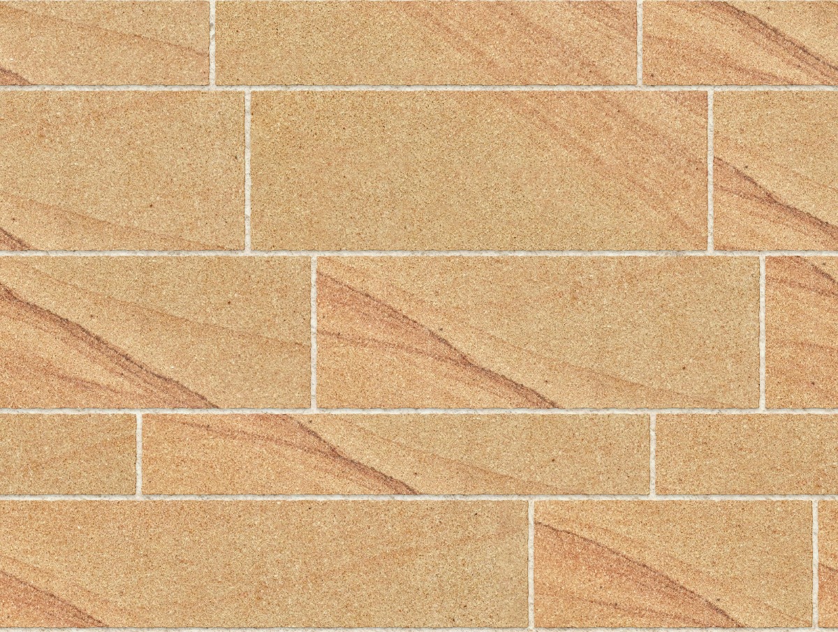 A seamless stone texture with honey sandstone blocks arranged in a Ashlar pattern