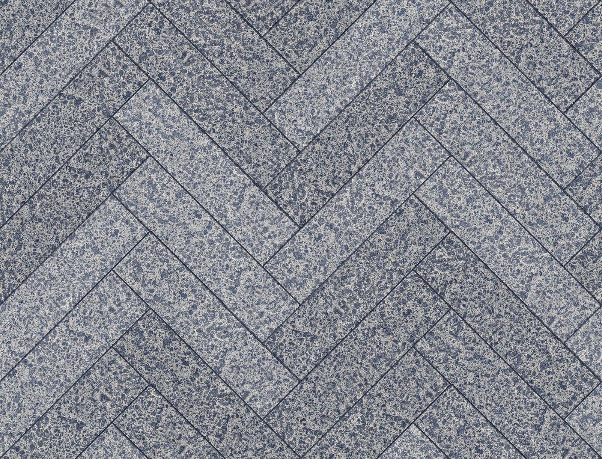 A seamless tile texture with scalite® blue sormiou tiles arranged in a Herringbone pattern