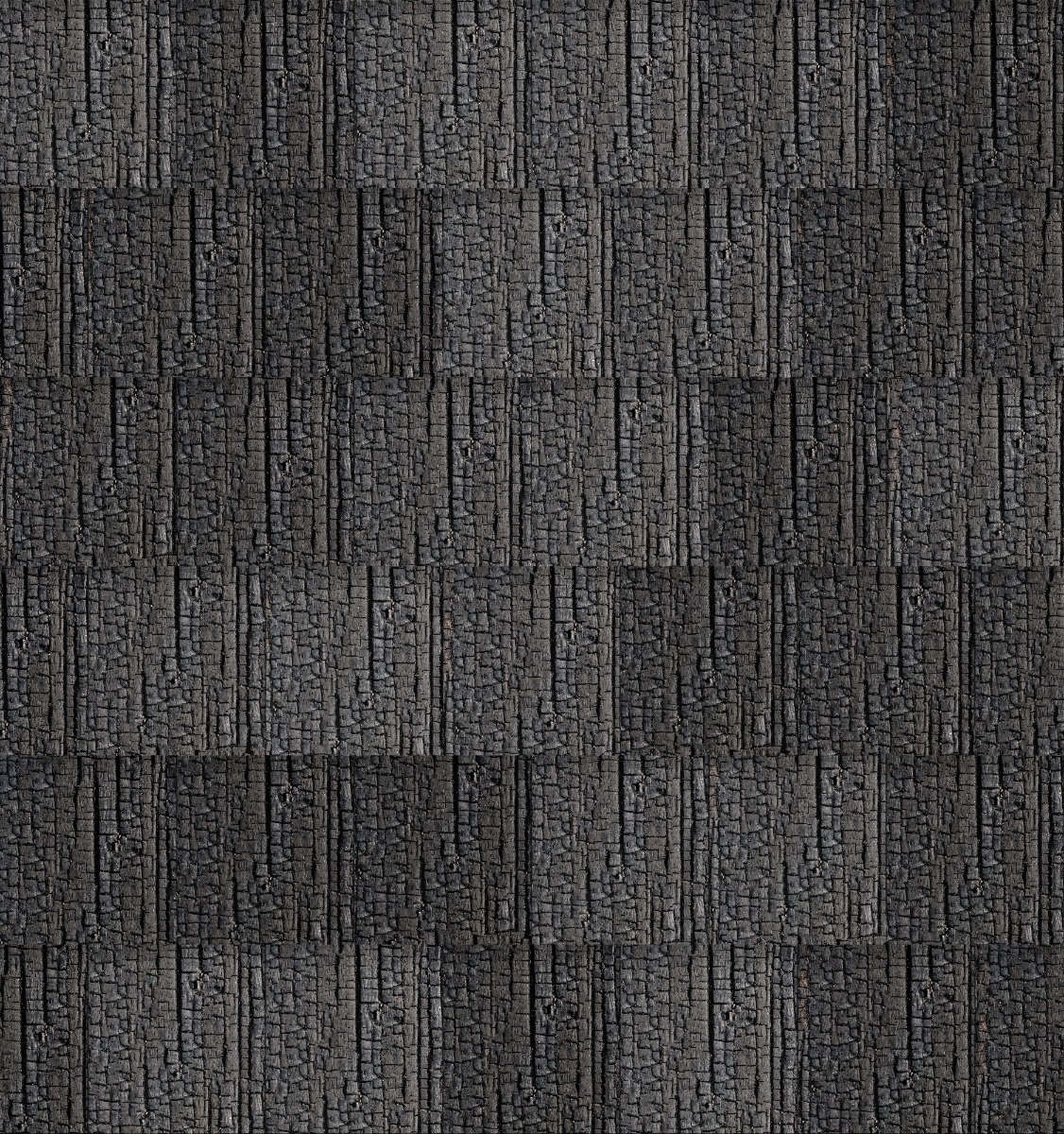 A seamless wood texture with charred timber boards arranged in a Stretcher pattern