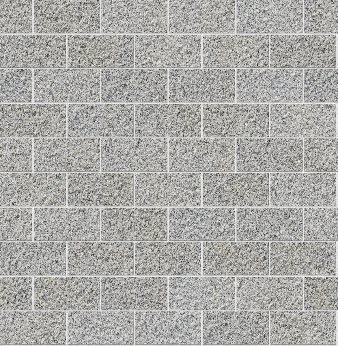 A seamless stone texture with silva montemuro cinza - bush hammered blocks arranged in a Stretcher pattern