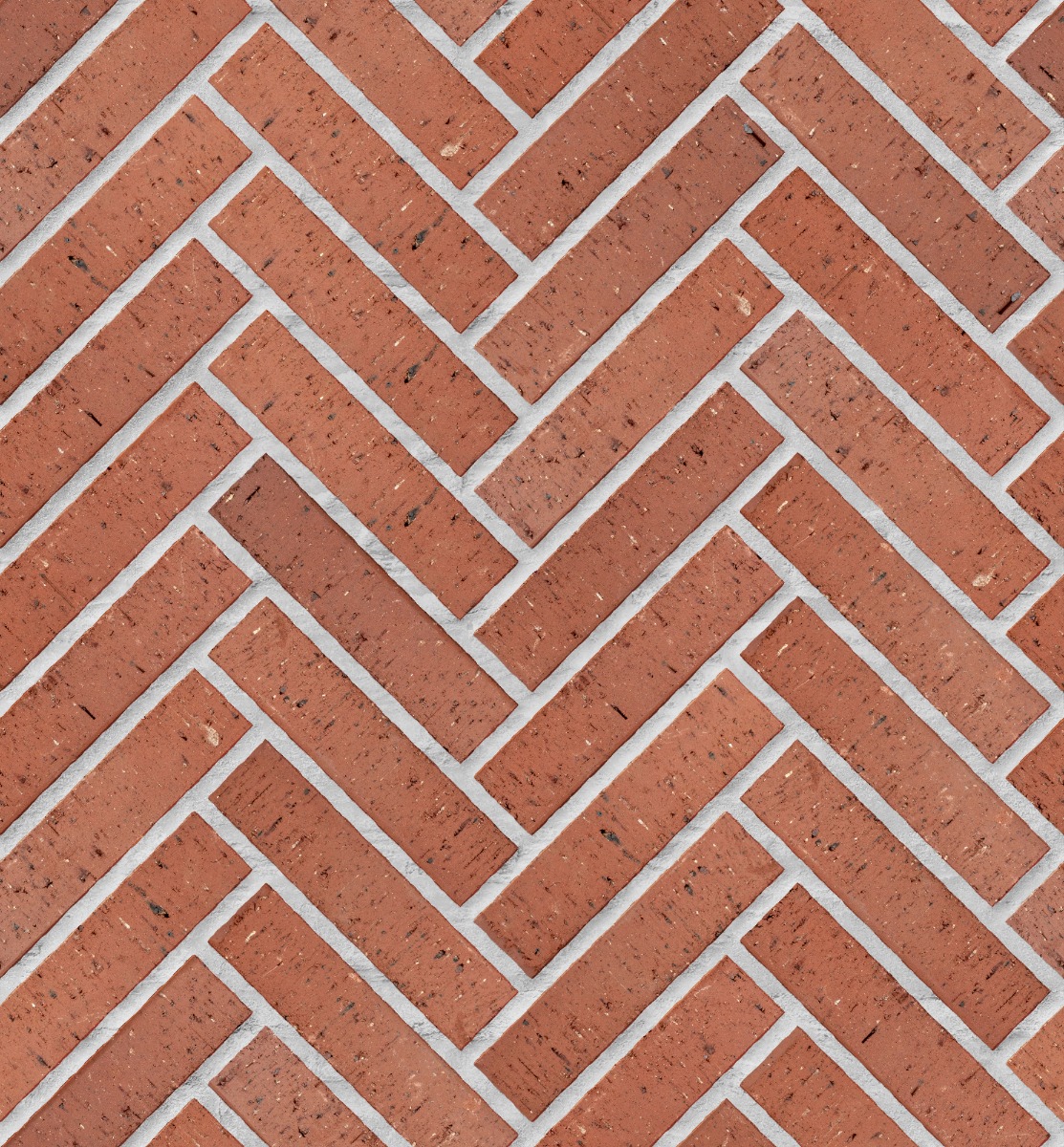 A seamless brick texture with burgundy piazza 50mm paver units arranged in a Herringbone pattern