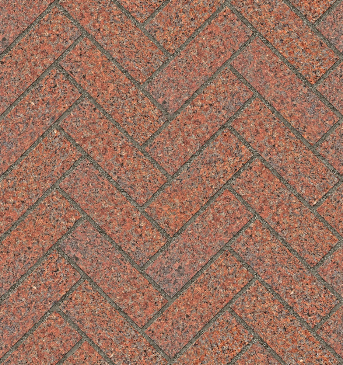 A seamless stone texture with red granite blocks arranged in a Herringbone pattern