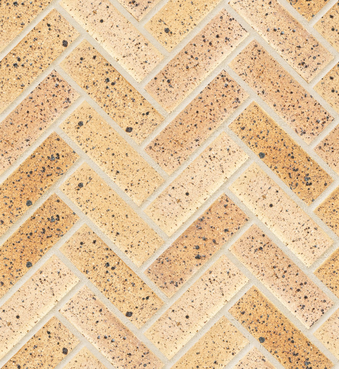 A seamless brick texture with topaz travertine fbs units arranged in a Herringbone pattern