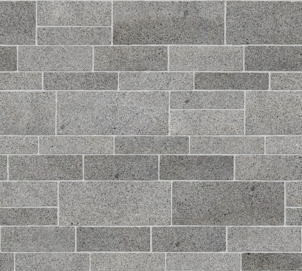A seamless stone texture with granite blocks arranged in a Broken Range Ashlar pattern