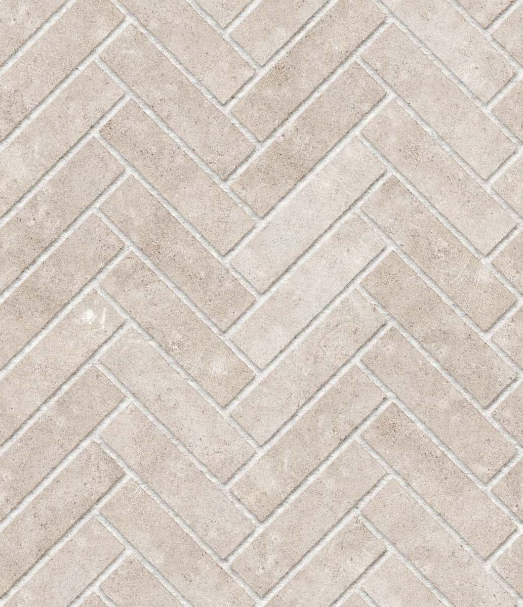 A seamless stone texture with limestone blocks arranged in a Herringbone pattern