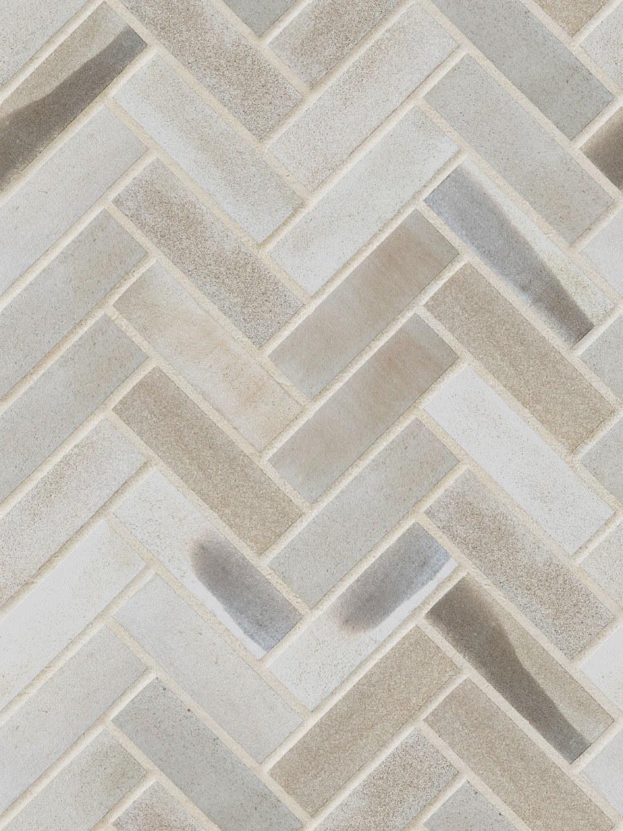 A seamless brick texture with darney sandstone brick units arranged in a Herringbone pattern