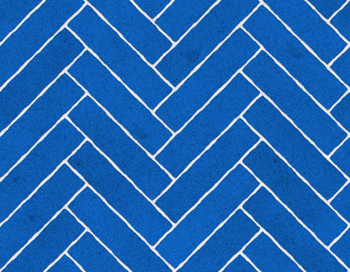 A seamless stone texture with granite blocks arranged in a Herringbone pattern