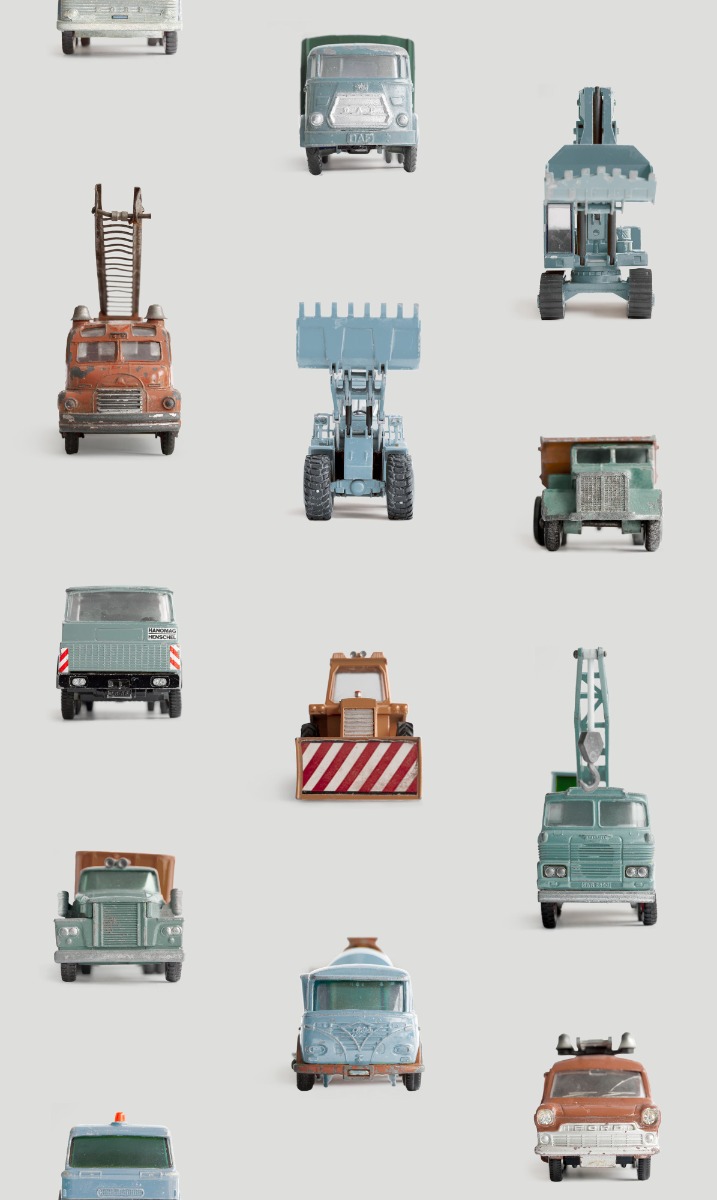 A seamless wallpaper texture with work vehicles wallpaper, light grey units arranged in a None pattern