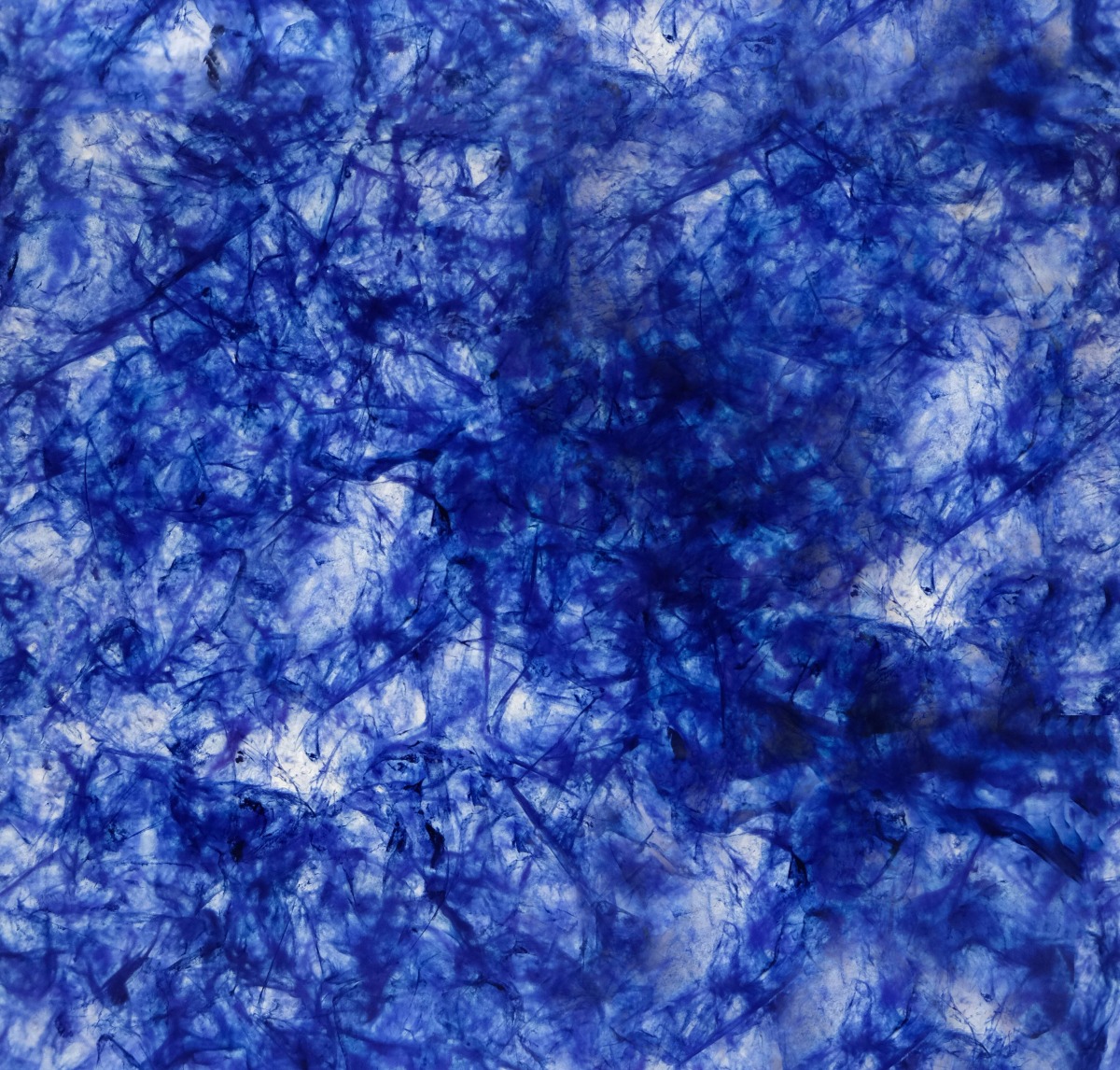 A seamless surfaces texture with remade bijou - tanzanite units arranged in a None pattern