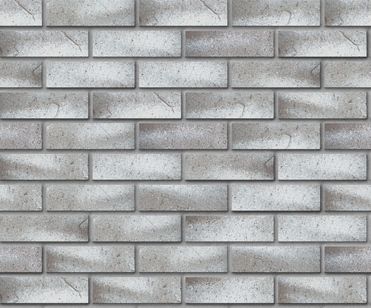 A seamless brick texture with snowdrift antique facebrick modular  units arranged in a Stretcher pattern