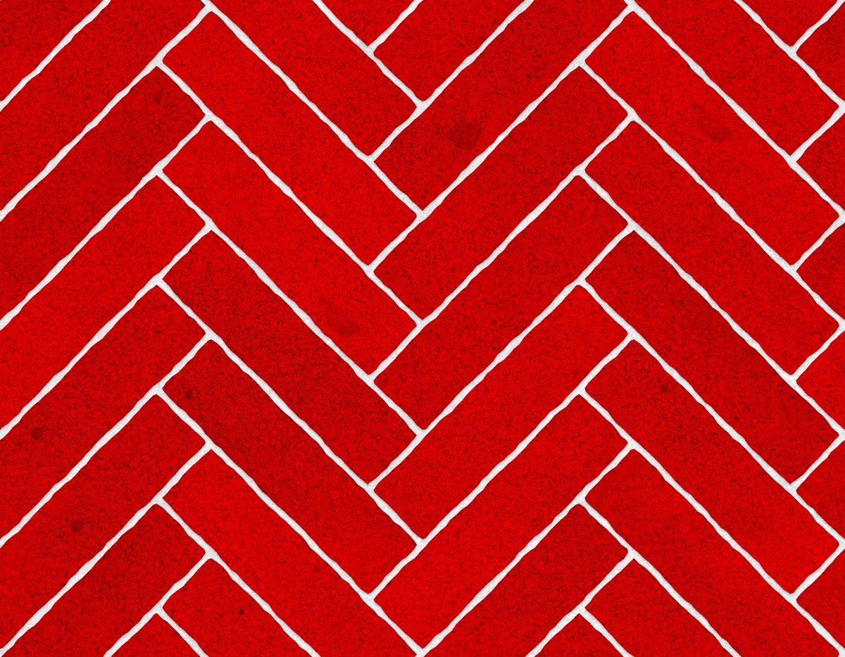 A seamless stone texture with granite blocks arranged in a Herringbone pattern