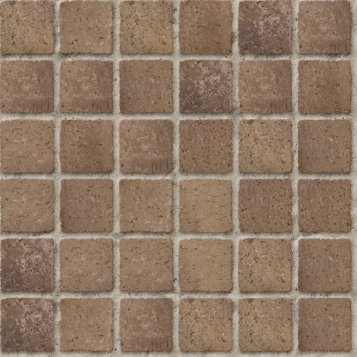 A seamless brick texture with worn clay cobble in desert units arranged in a Stack pattern