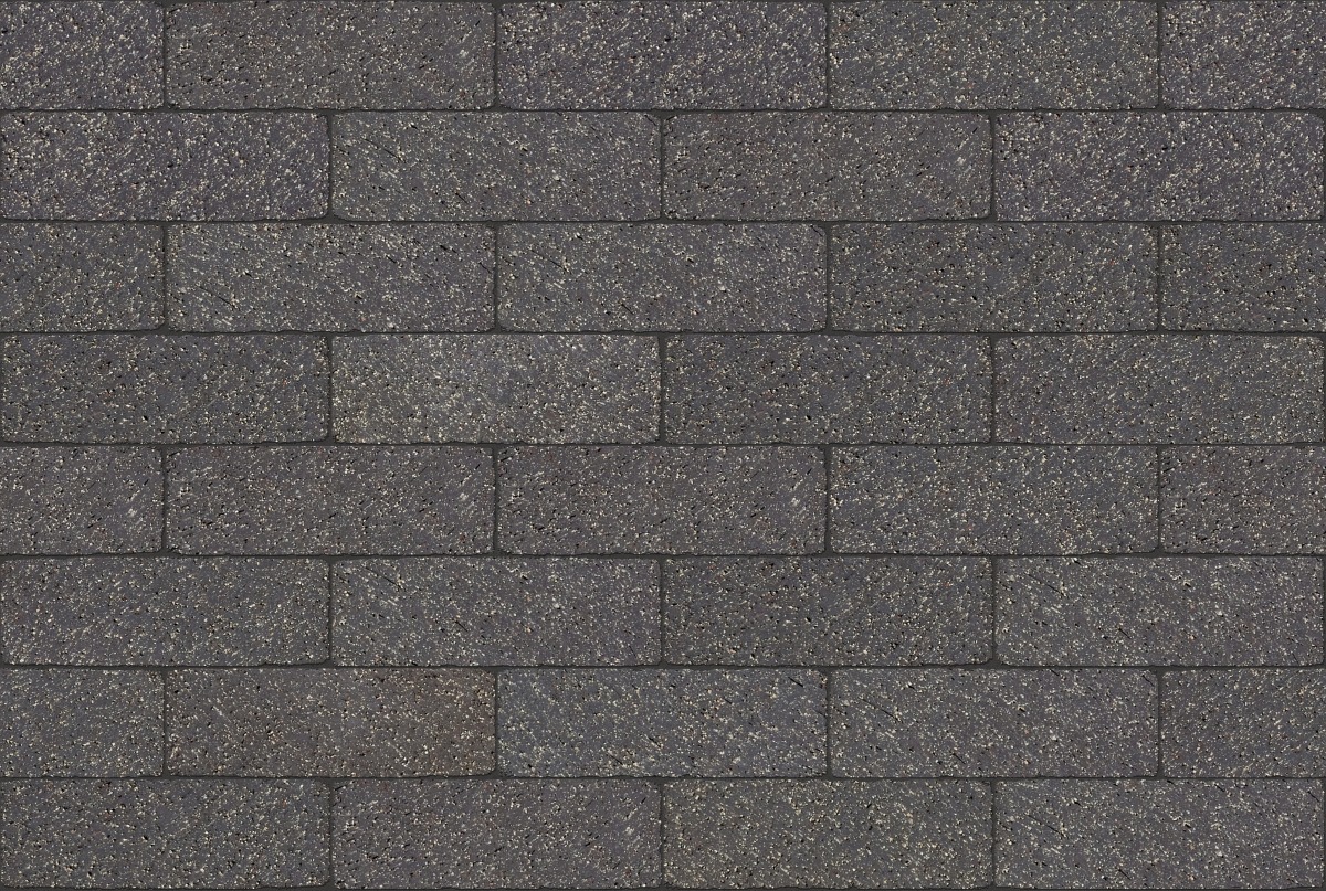 A seamless landscaping texture with carbon black tumbled pavers units arranged in a Stretcher pattern
