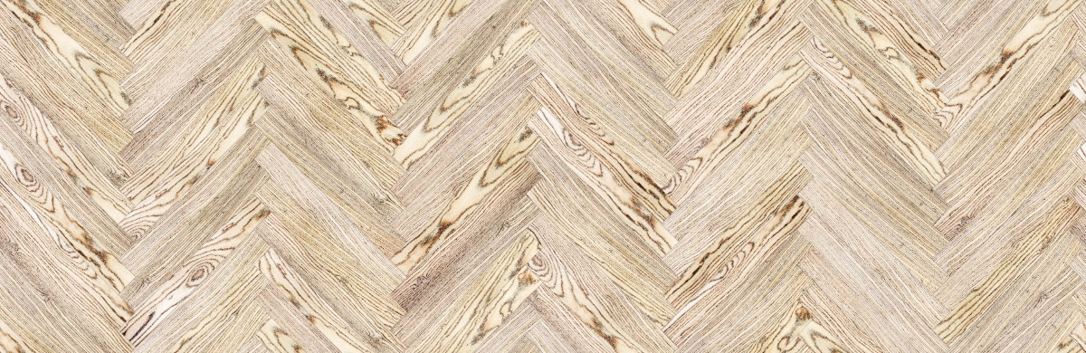 A seamless wood texture with bocote boards arranged in a Herringbone pattern