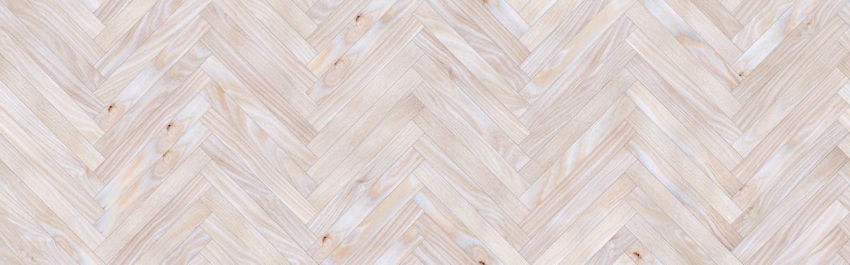 A seamless wood texture with douglas fir boards arranged in a Herringbone pattern