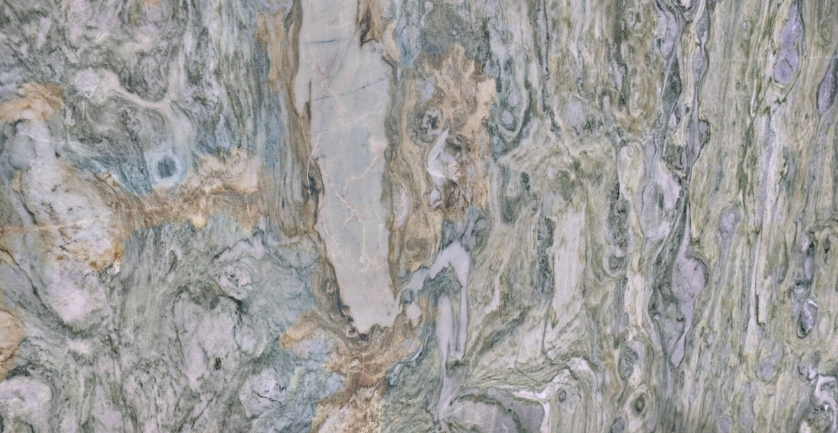 A seamless stone texture with fusion green - quartzite blocks arranged in a None pattern