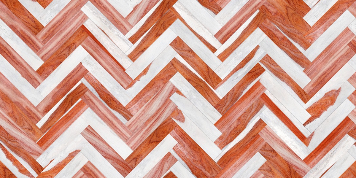 A seamless wood texture with padauk - patterned boards arranged in a Herringbone pattern