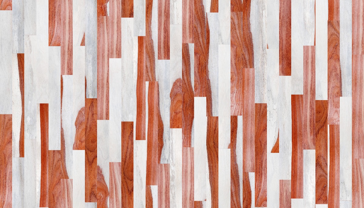 A seamless wood texture with padauk - patterned boards arranged in a Staggered pattern