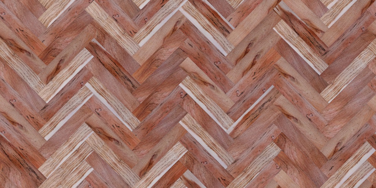 A seamless wood texture with rhodesian teak boards arranged in a Herringbone pattern