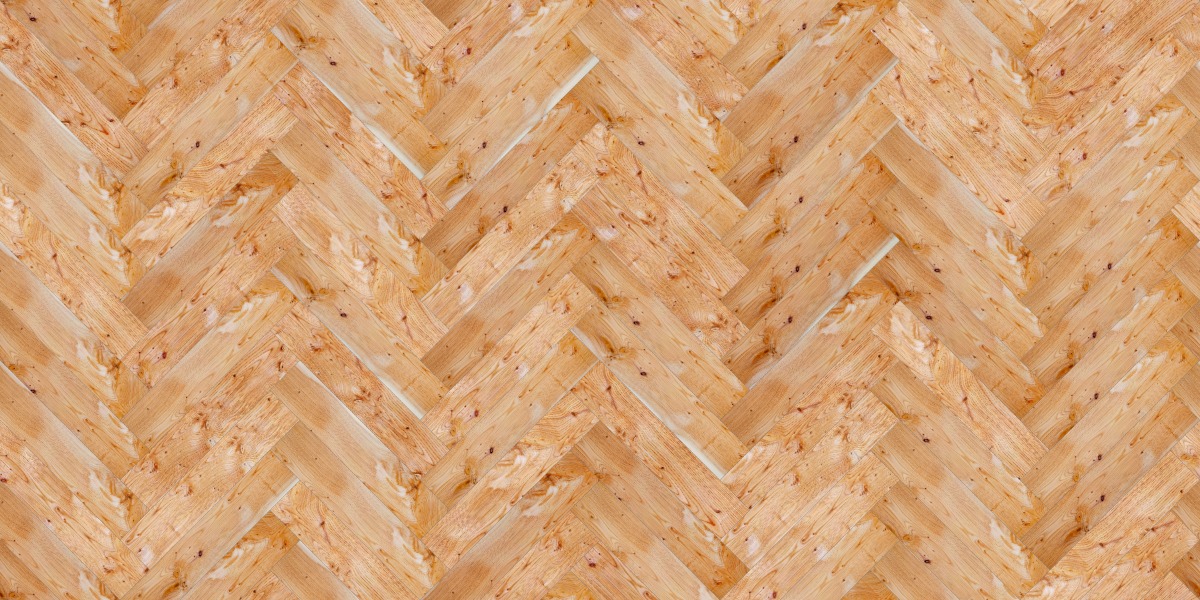 A seamless wood texture with yew boards arranged in a Herringbone pattern