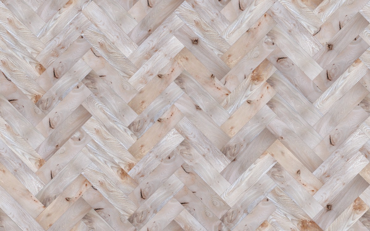A seamless wood texture with elm - pippy boards arranged in a Herringbone pattern