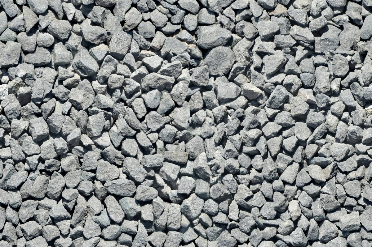 A seamless stone texture with black scottish whinstone gravel blocks arranged in a None pattern