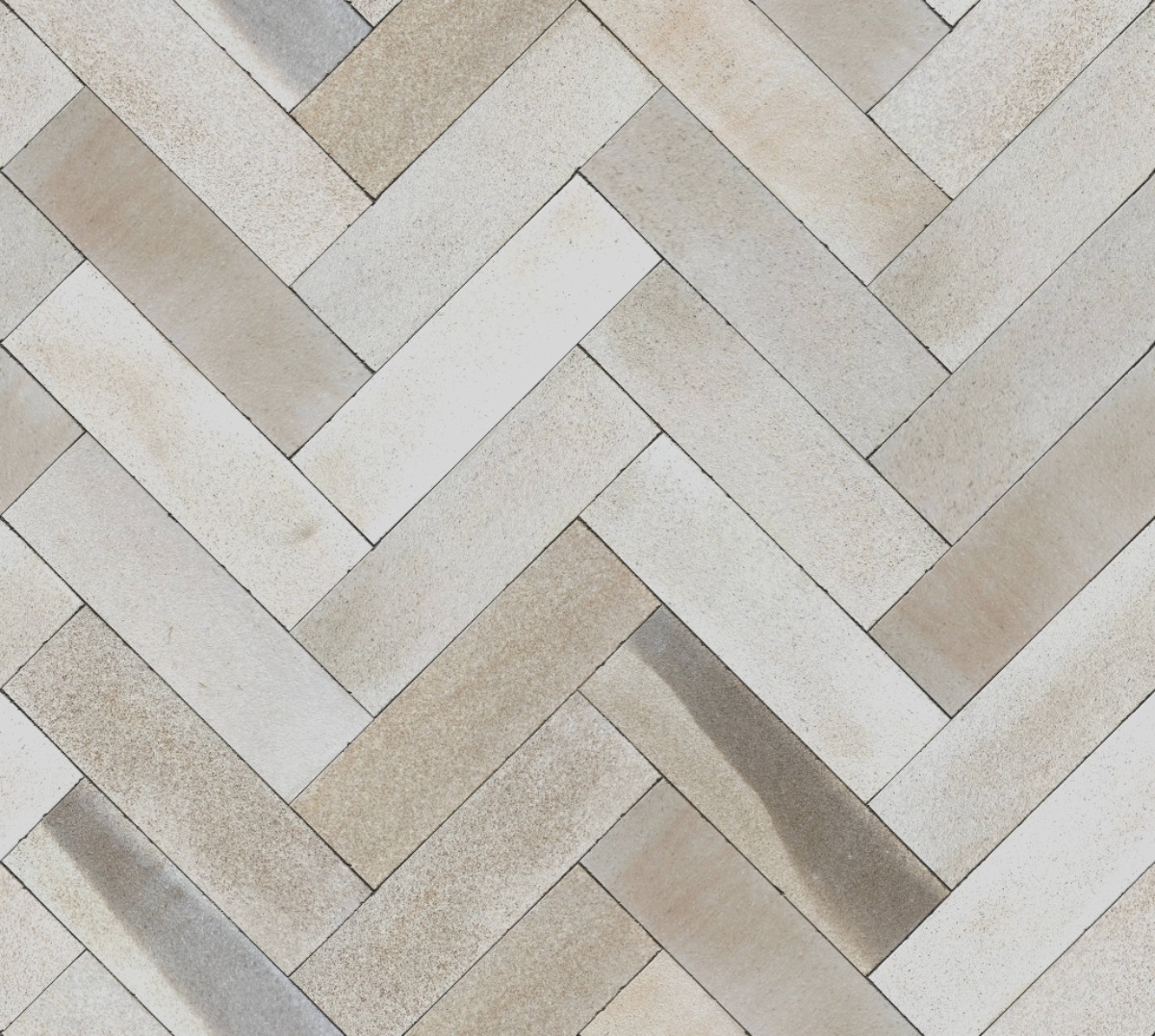 A seamless brick texture with darney sandstone brick units arranged in a Herringbone pattern