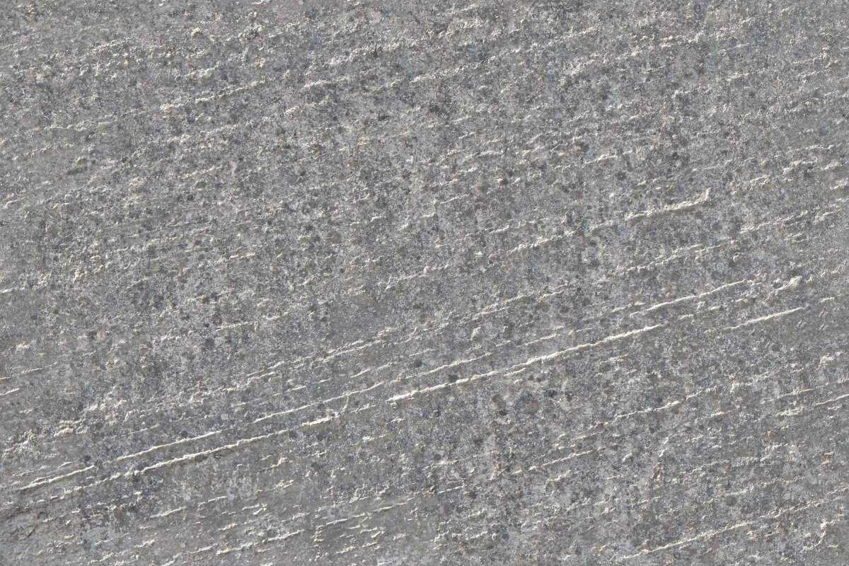 A seamless concrete texture with rough concrete blocks arranged in a None pattern